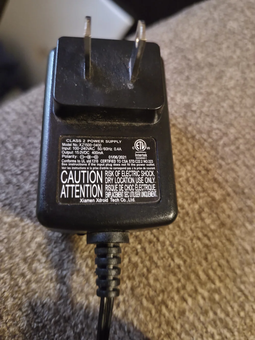 black AC adapter for a Remington charging cord, intended for use with various MB